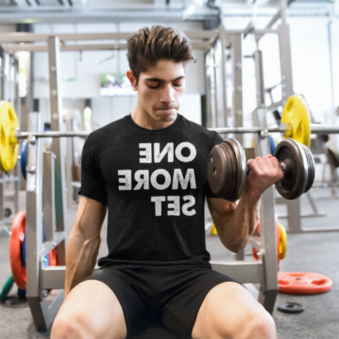 Man doing bicep curls in the gym - One More Set