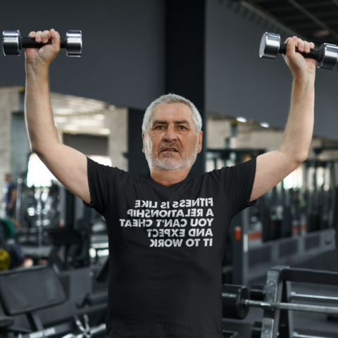 Middle-aged man lifting weights - Fitness is like a relationship You can’t cheat and expect it to work