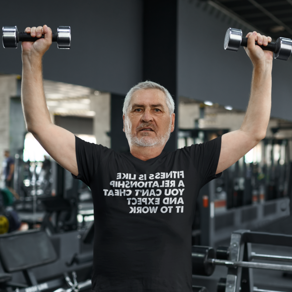 Middle-aged man lifting weights - Fitness is like a relationship You can’t cheat and expect it to work