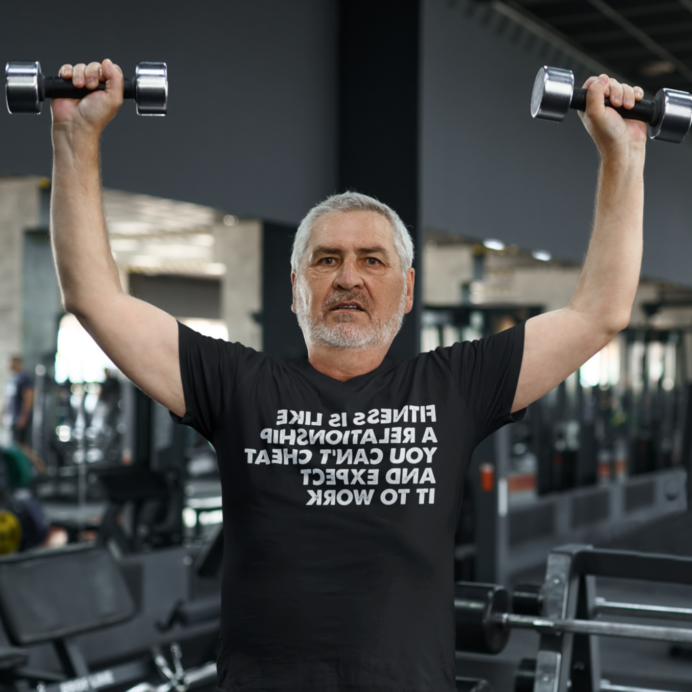 Middle-aged man lifting weights - Fitness is like a relationship You can’t cheat and expect it to work