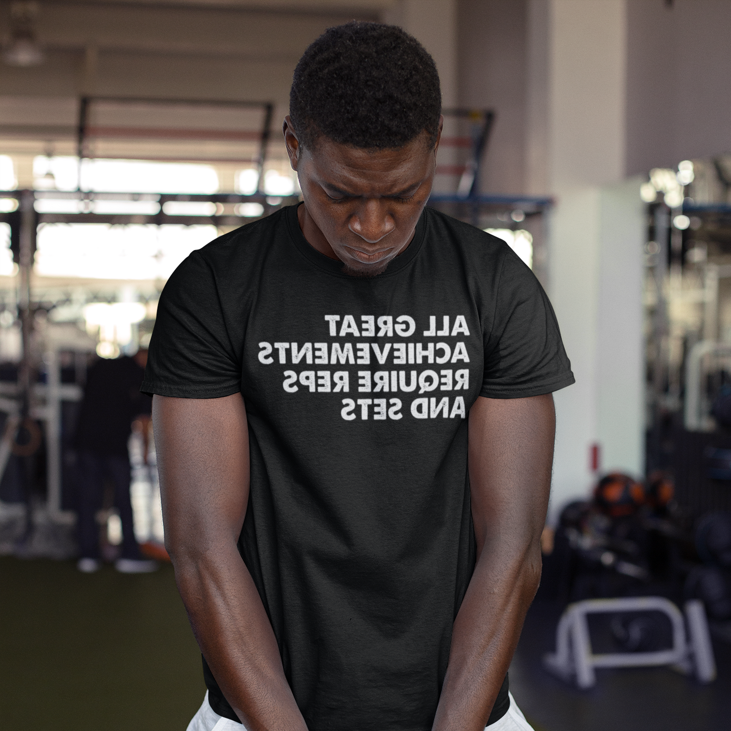 Strong man holding a kettlebell at the gym - All great achievements require reps and sets