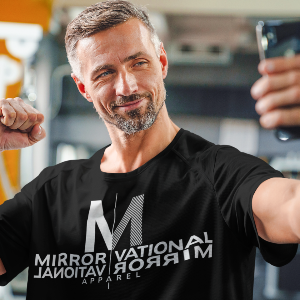 Middle aged man taking a selfie at the gym - Mirrorvational