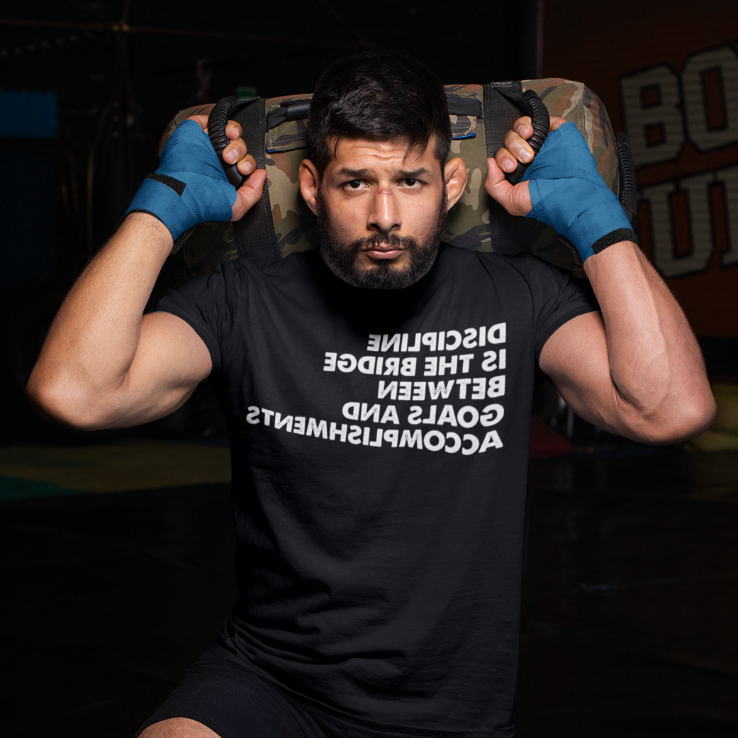 MMA fighter kneeling at a boxing gym